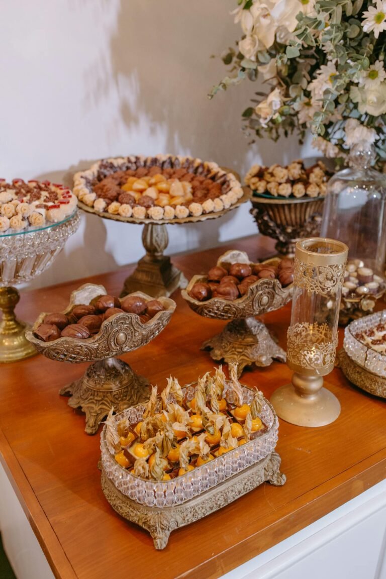 Luxurious arrangement of colorful pastries on ornate stands, ideal for elegant celebrations.